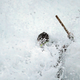 A ‘percebeiro’ emerges from a wave.